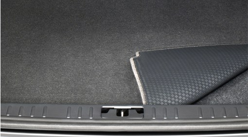 Reversible textile/plastic luggage compartment mat